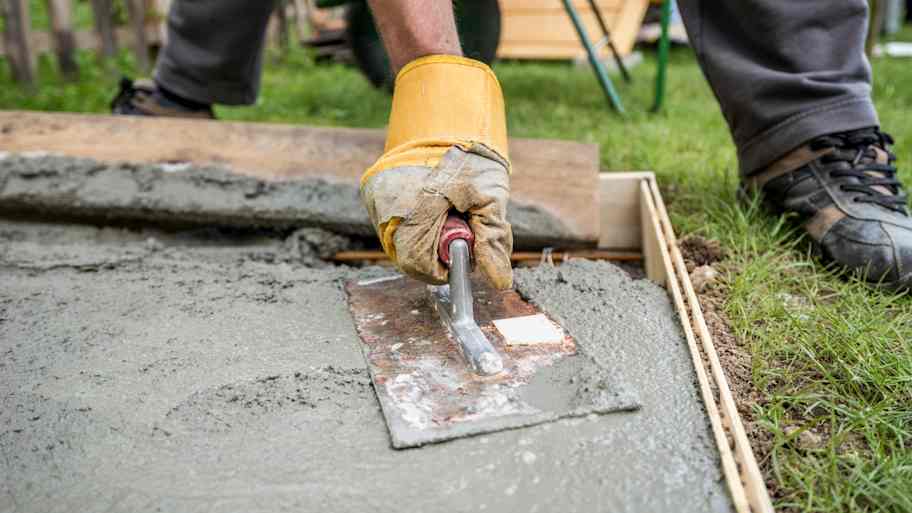 paver smoothing fresh concrete