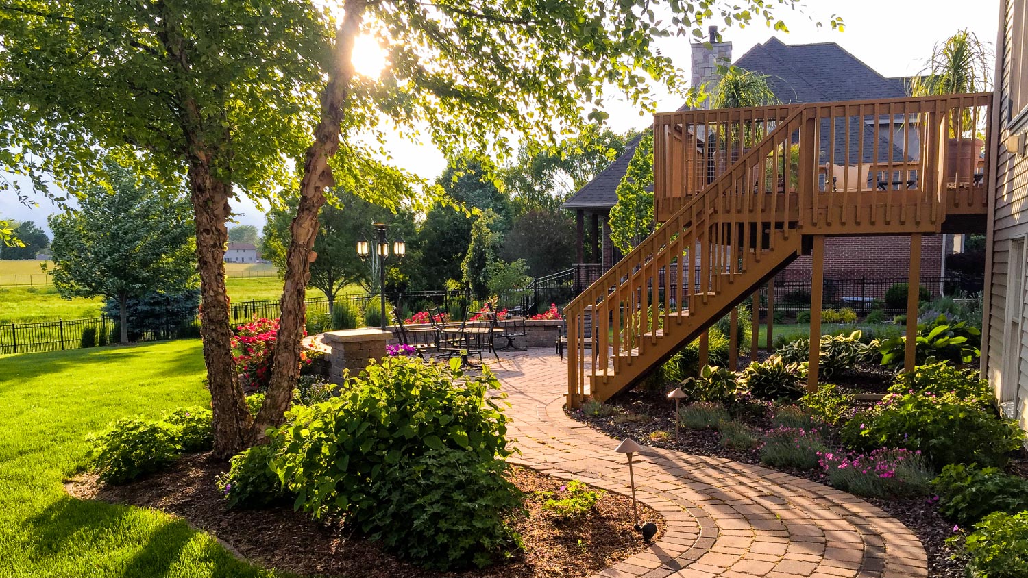 A paver walkway in the backyard