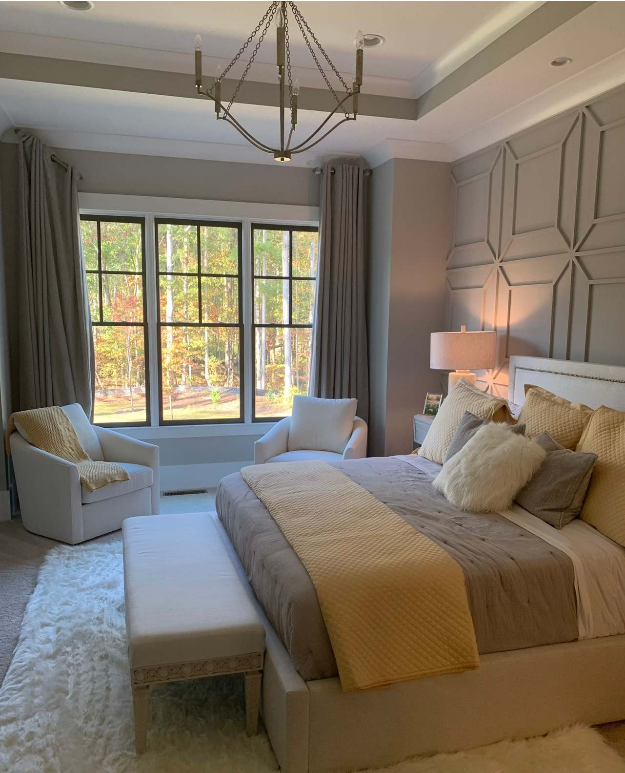 remodeled bedroom with grey bed