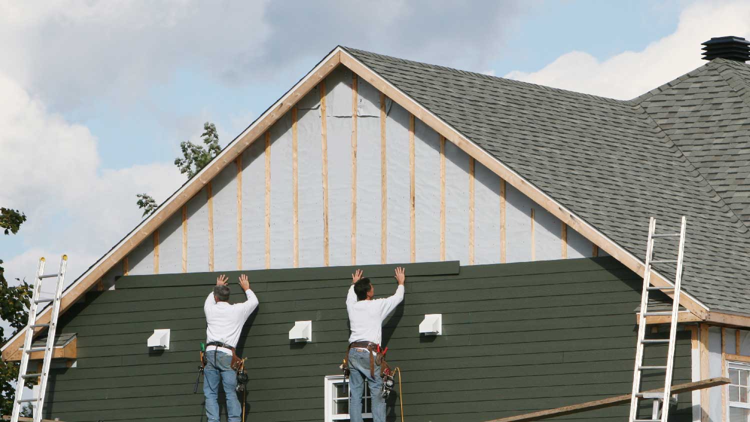 People replacing wood siding