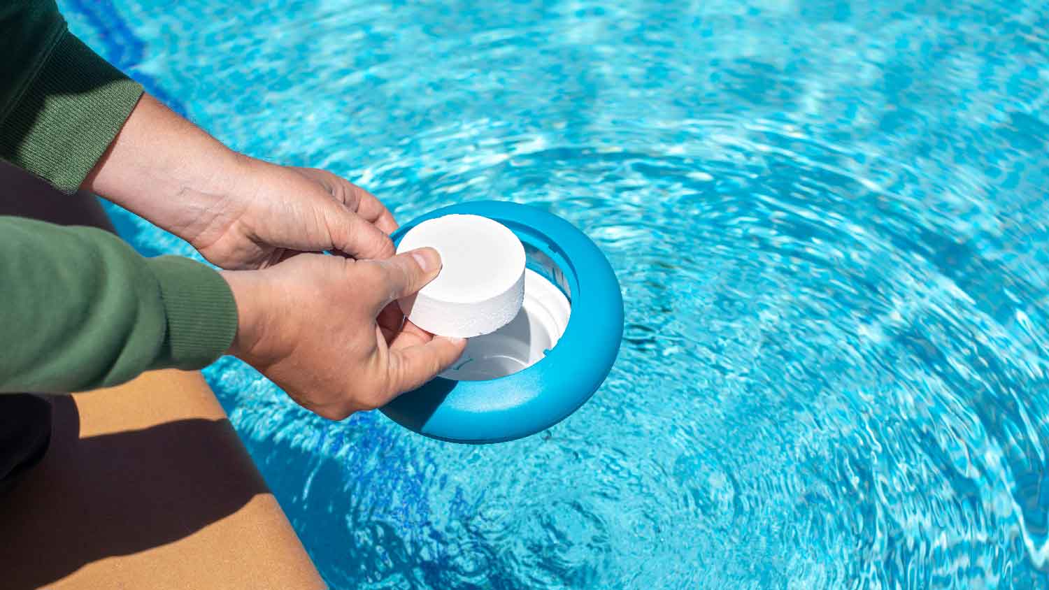 A person doing pool shock to his swimming pool