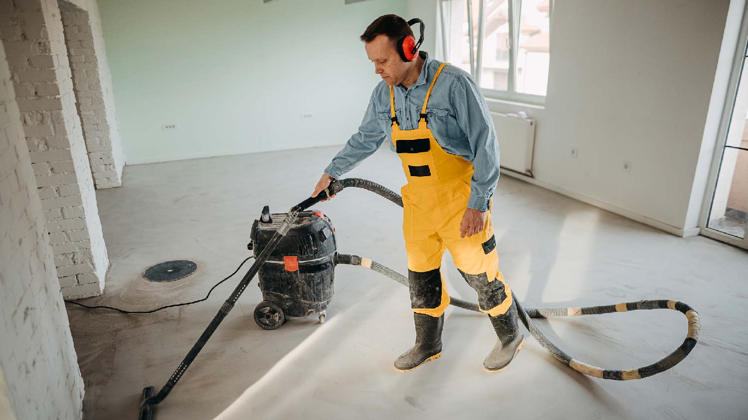 A person doing a post construction cleaning of a house