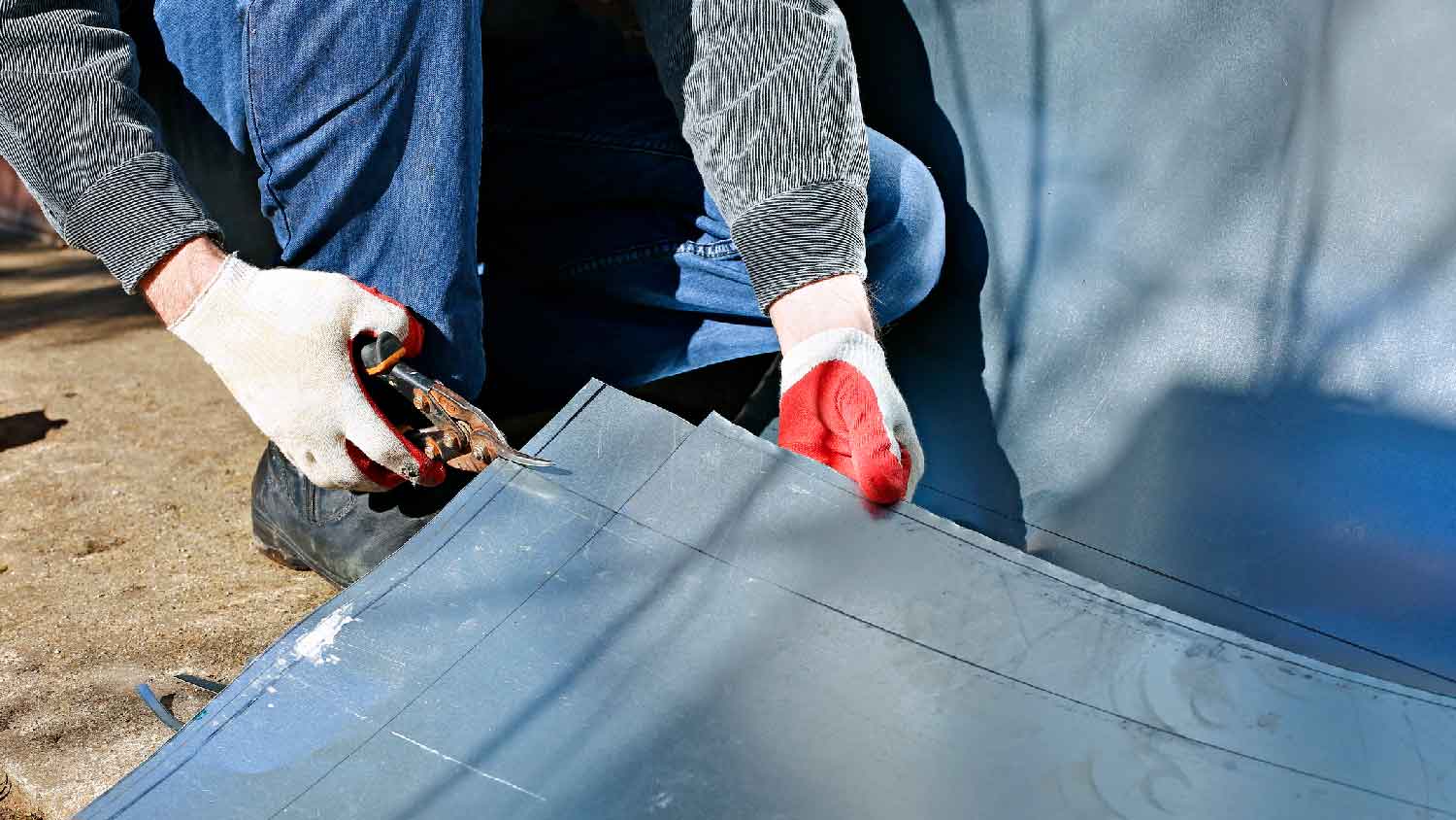 A person fixing a sheet metal