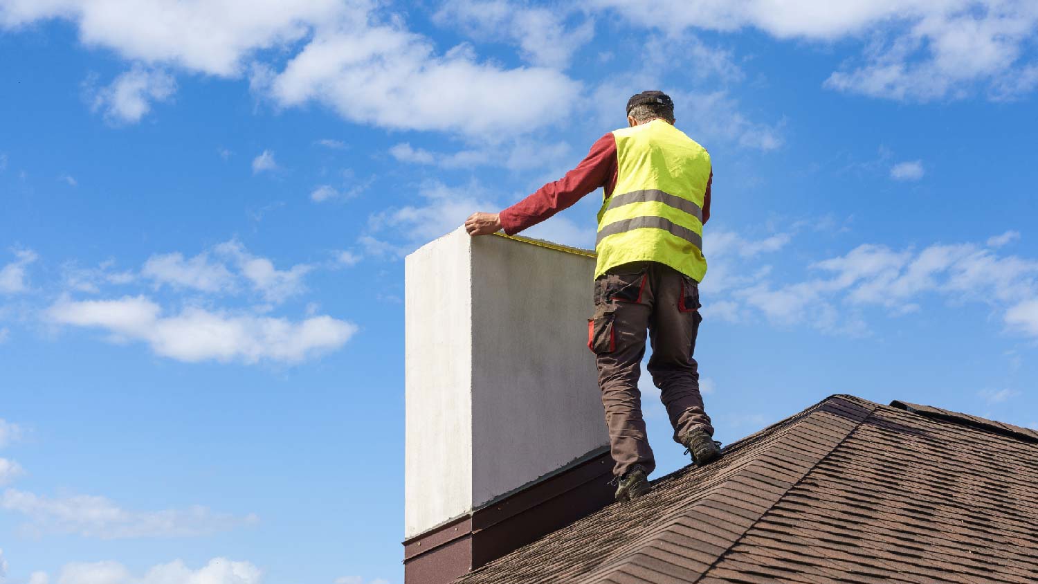 A person inspecting a chimney