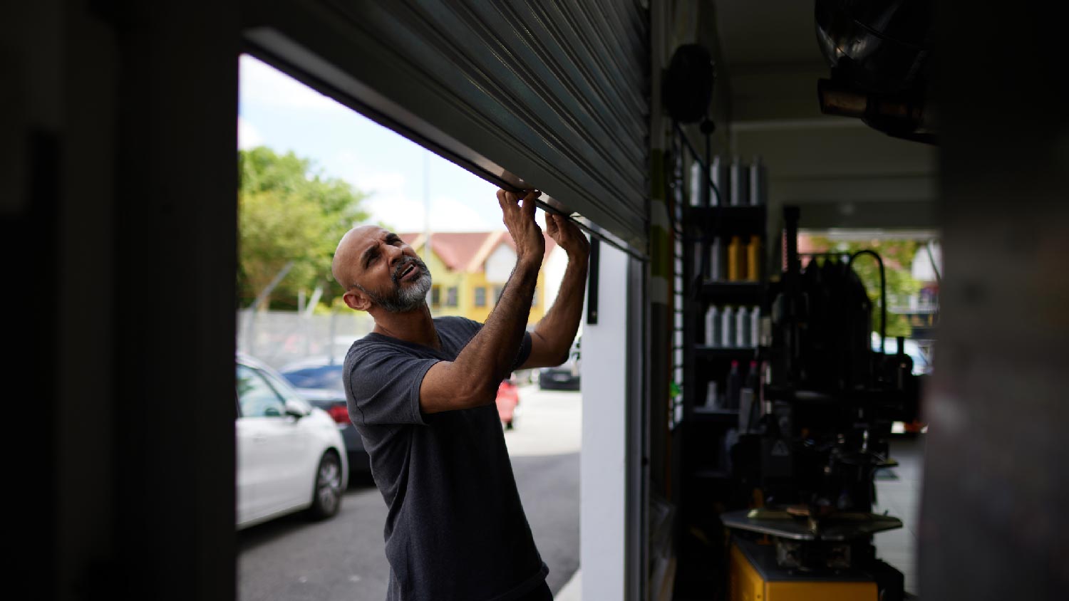 A person inspecting a garage door