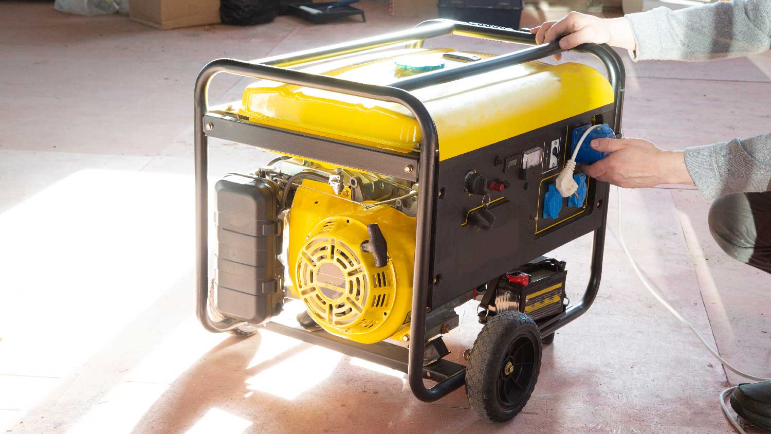 A person inspecting a portable generator 