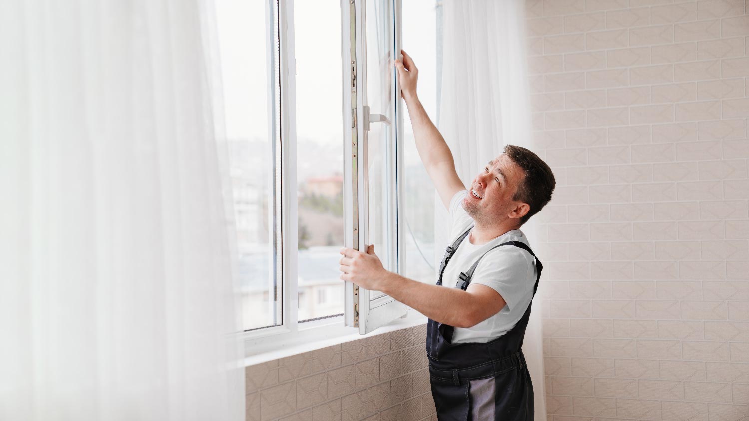 A person installing double pane windows