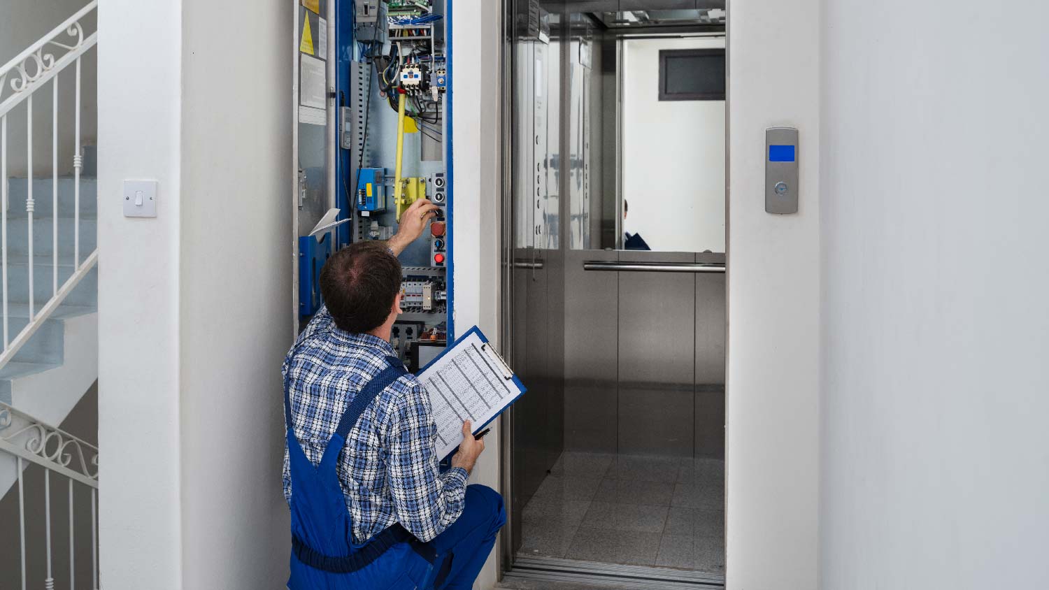 A person installing a home elevator