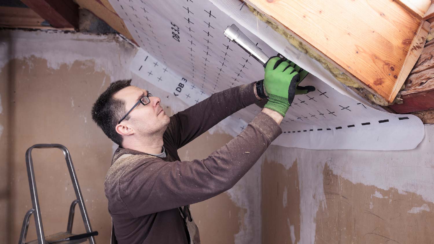 A person insulating the entire roof