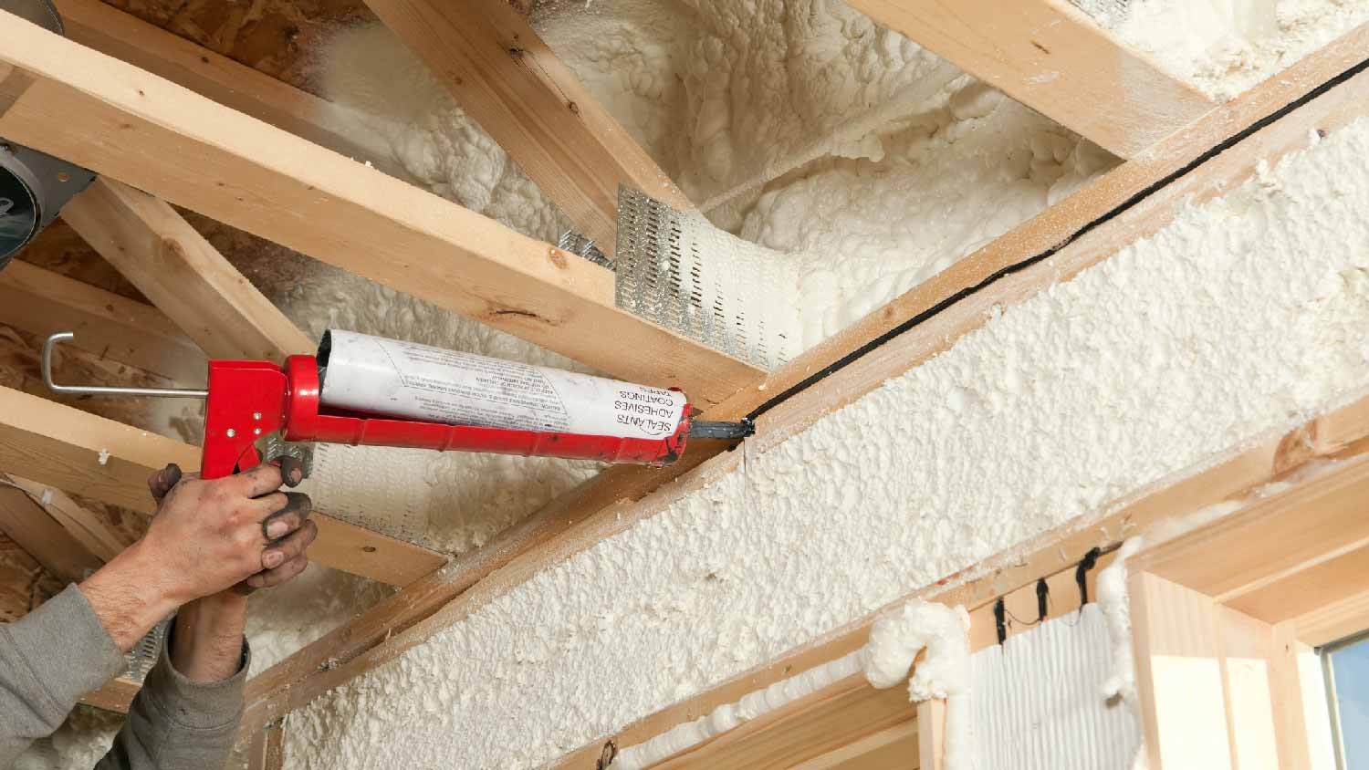 A person insulating a garage