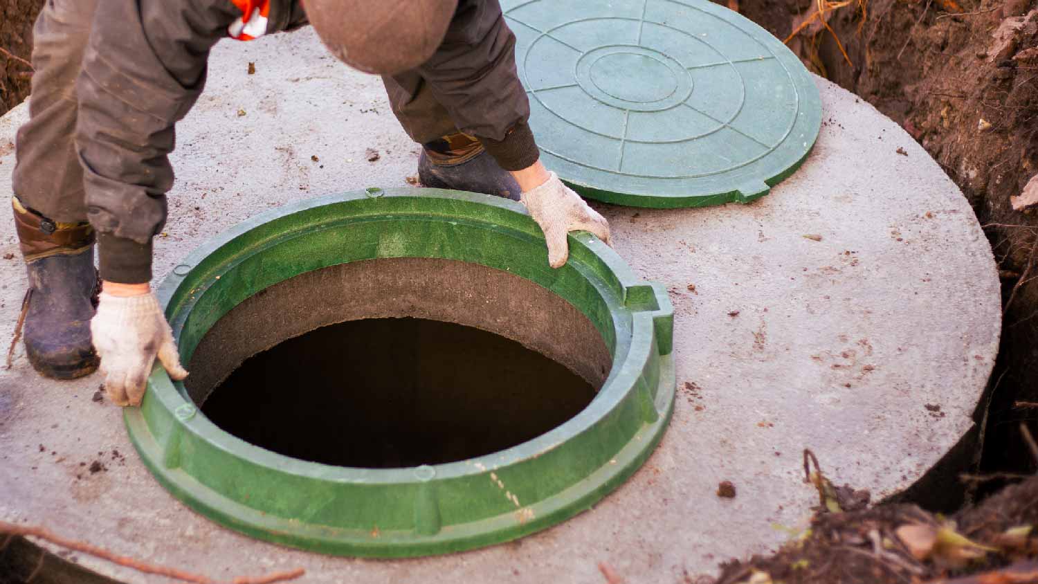 A person removing a cesspool