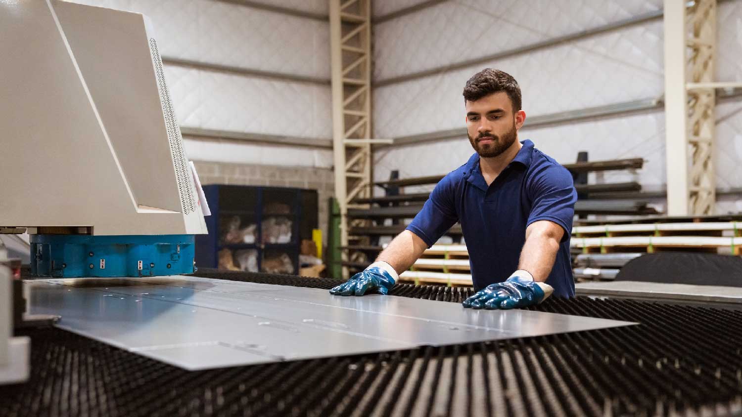 A person working at a sheet metal factory