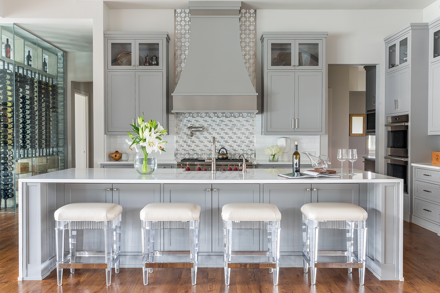 white kitchen with pewter range hood