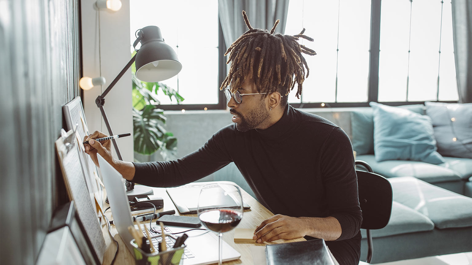 artist working in living room on a drawing canvas