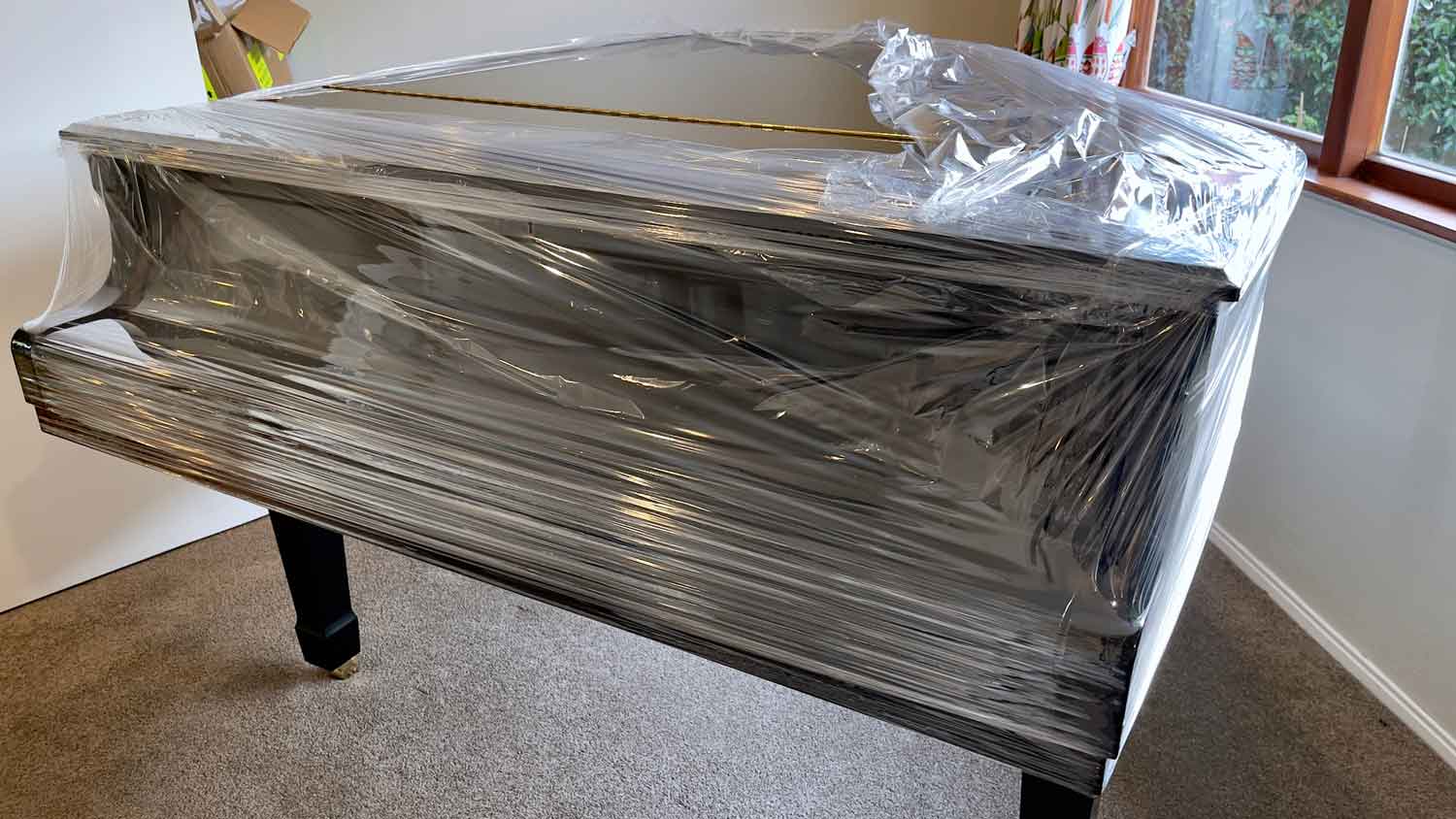 A piano covered in plastic wrapPhoto: Jasmine White / iStock / Getty Images Plus / Getty Images