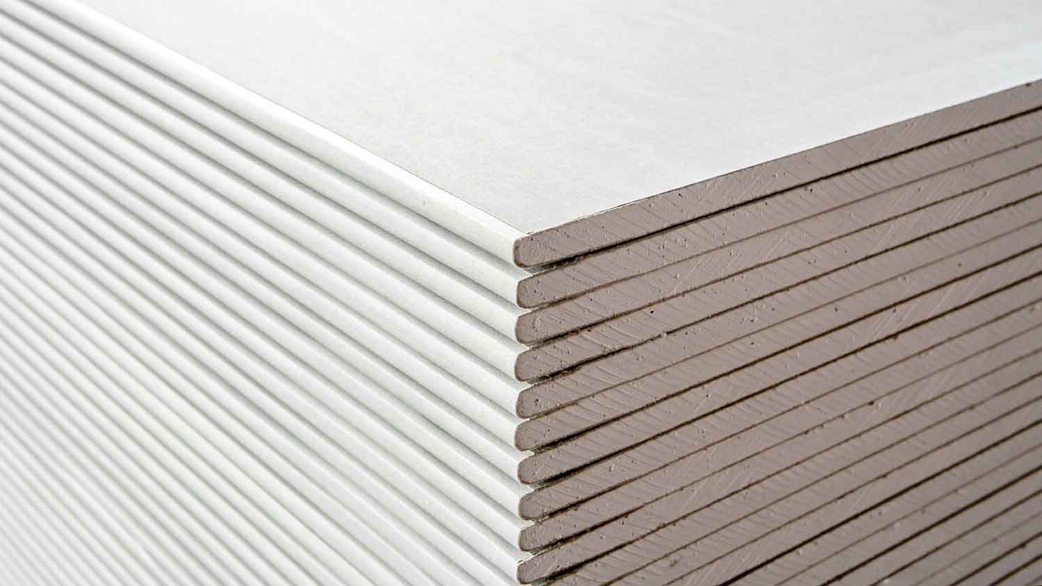 Closeup of staked drywall sheets