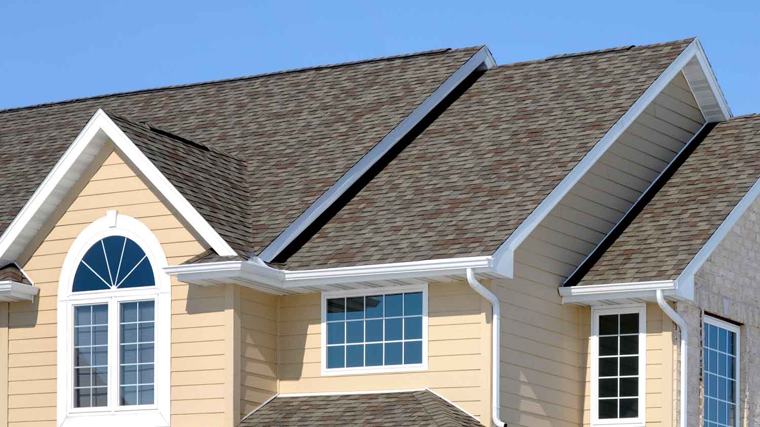 Asphalt shingles attached to a pitched roof