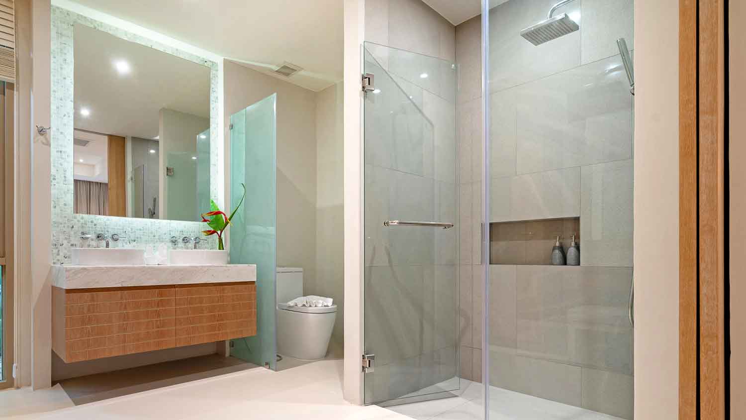 Pivot shower door installed in a luxury bathroom