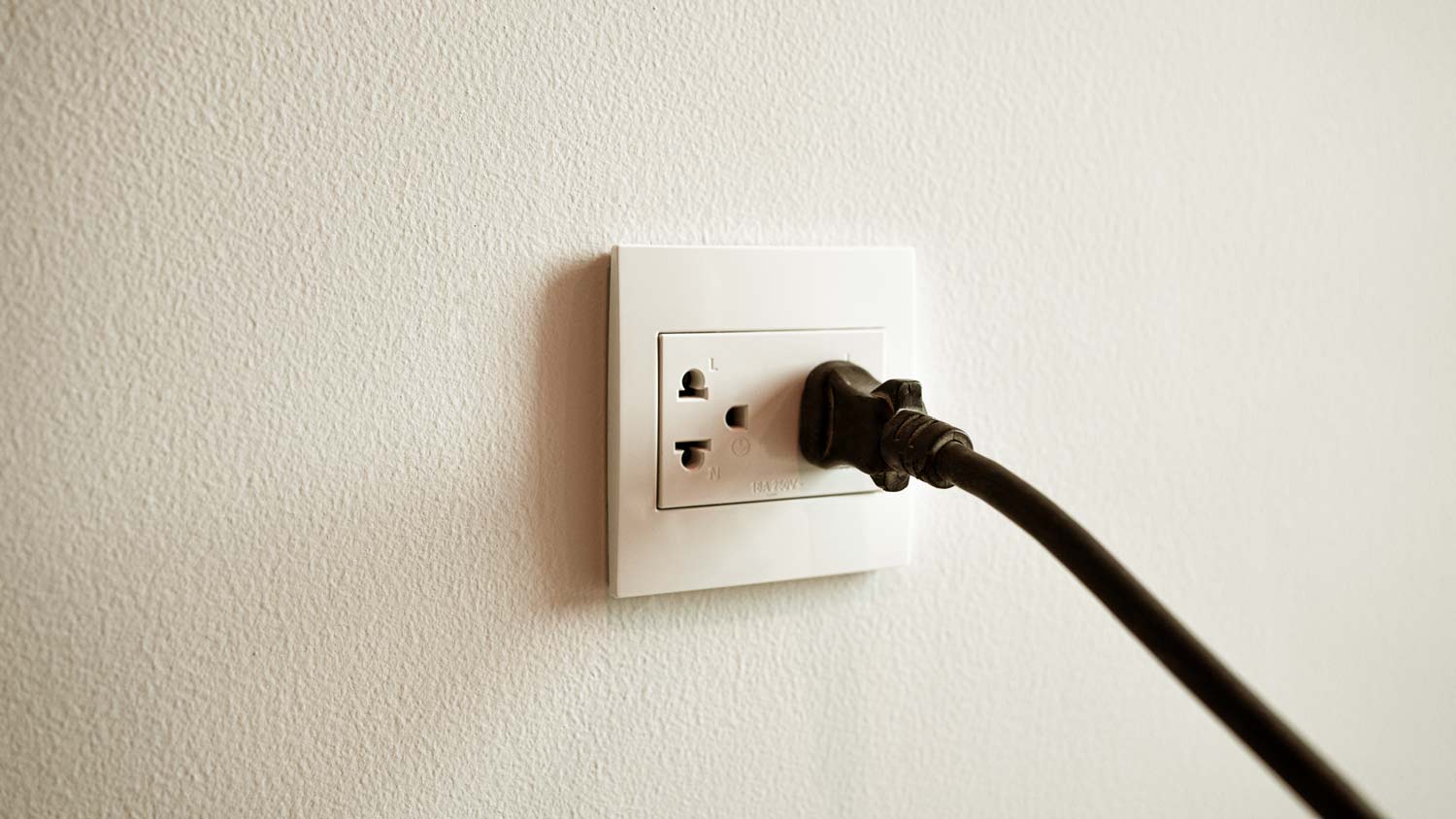 cord plugged into horizontal outlet