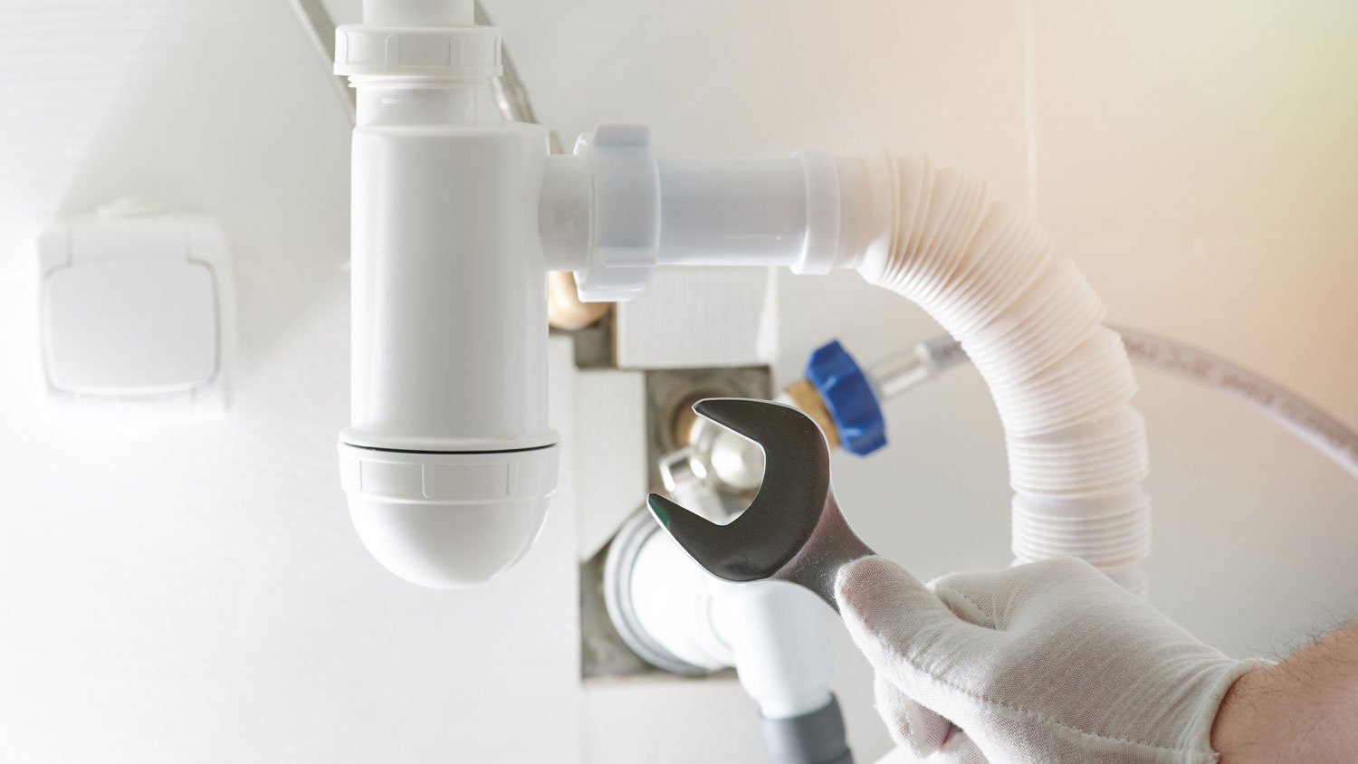 A plumber attaching a vent pipe