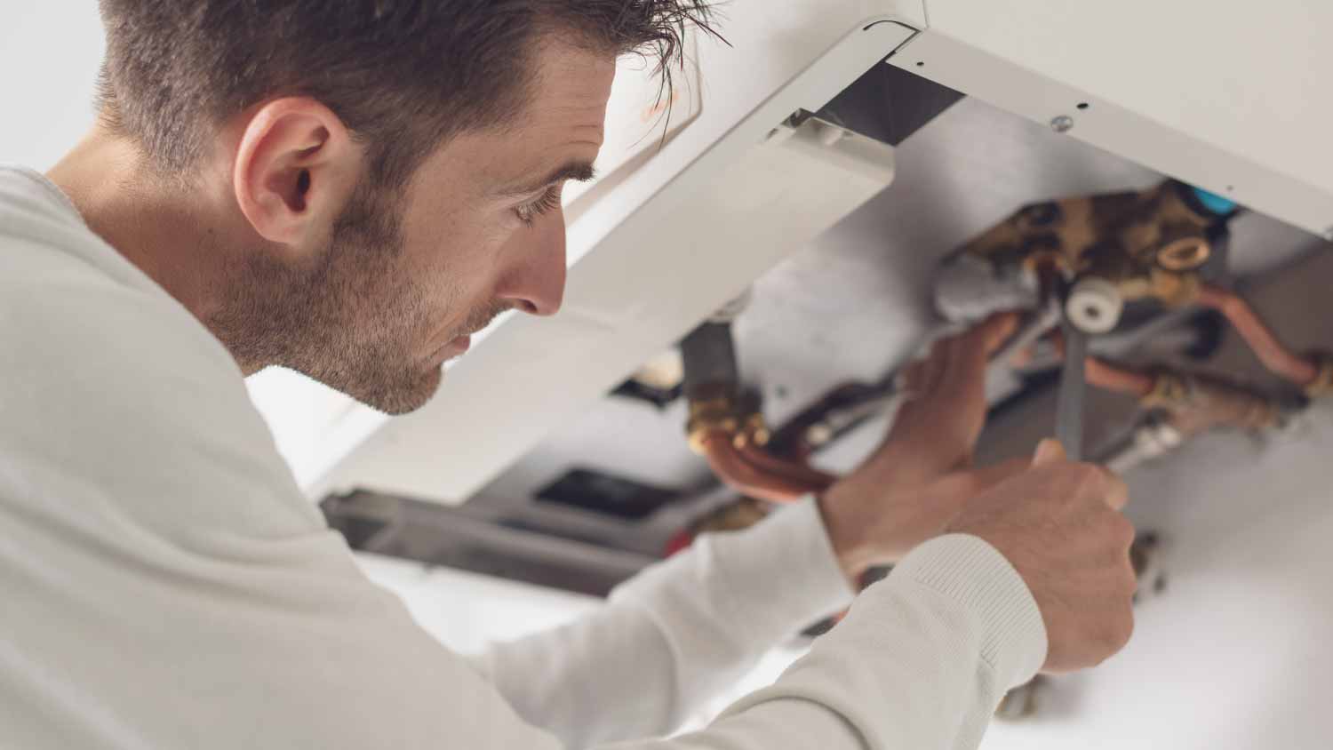 Plumber checking a boiler