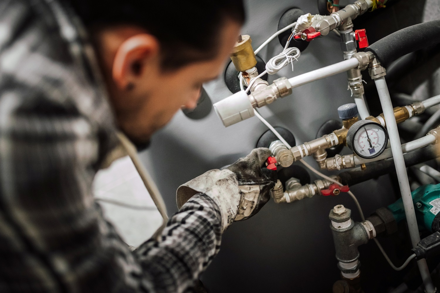 A plumber checking the pipes