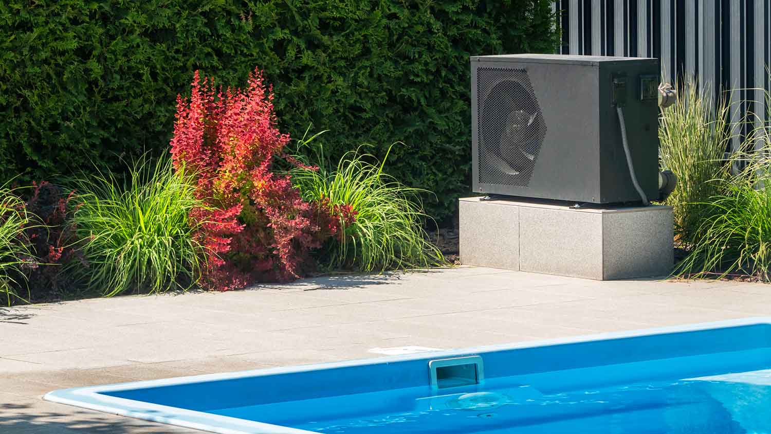 Heat pump unit near the swimming pool