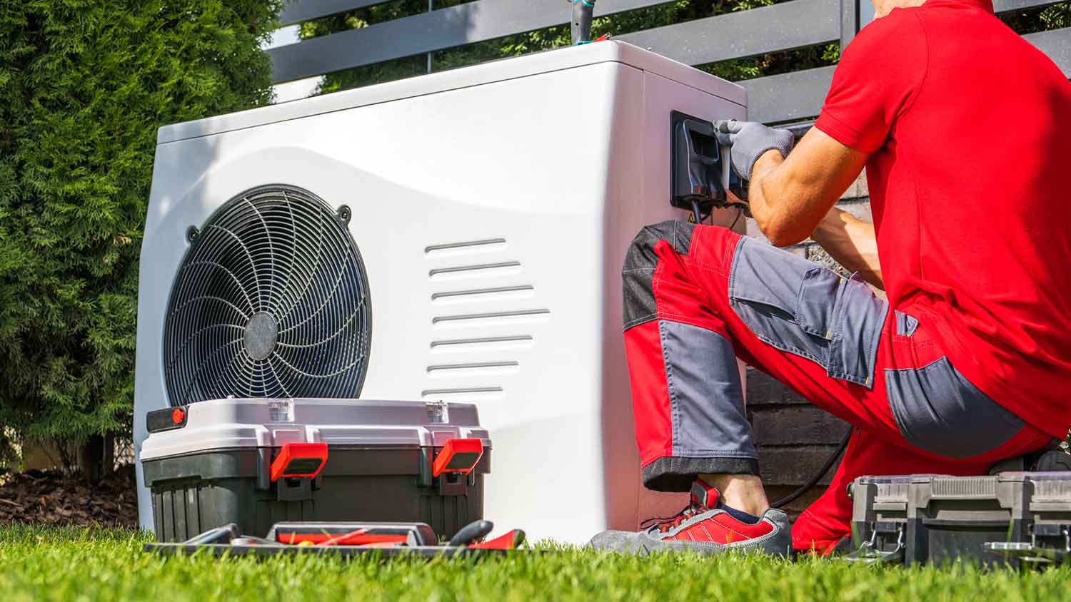 Technician checking electric pool heater