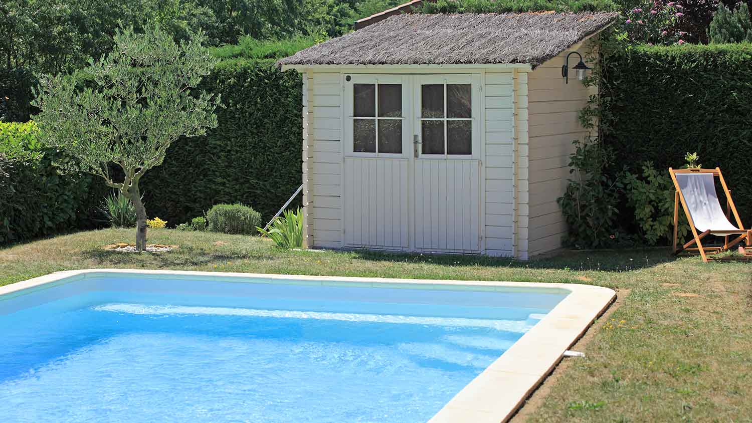 Storage shed by the swimming pool