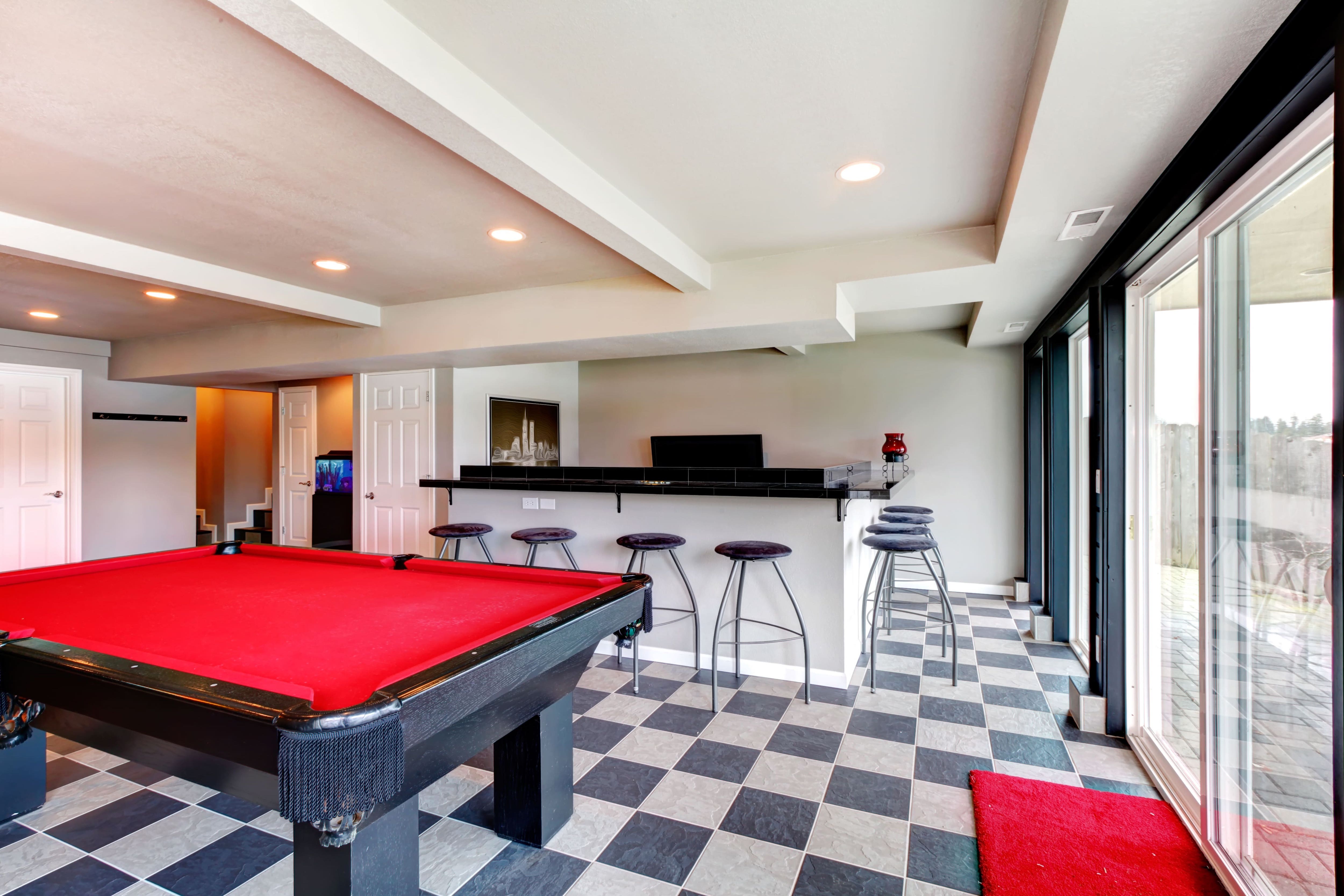 Bar and pool table in open concept rec room