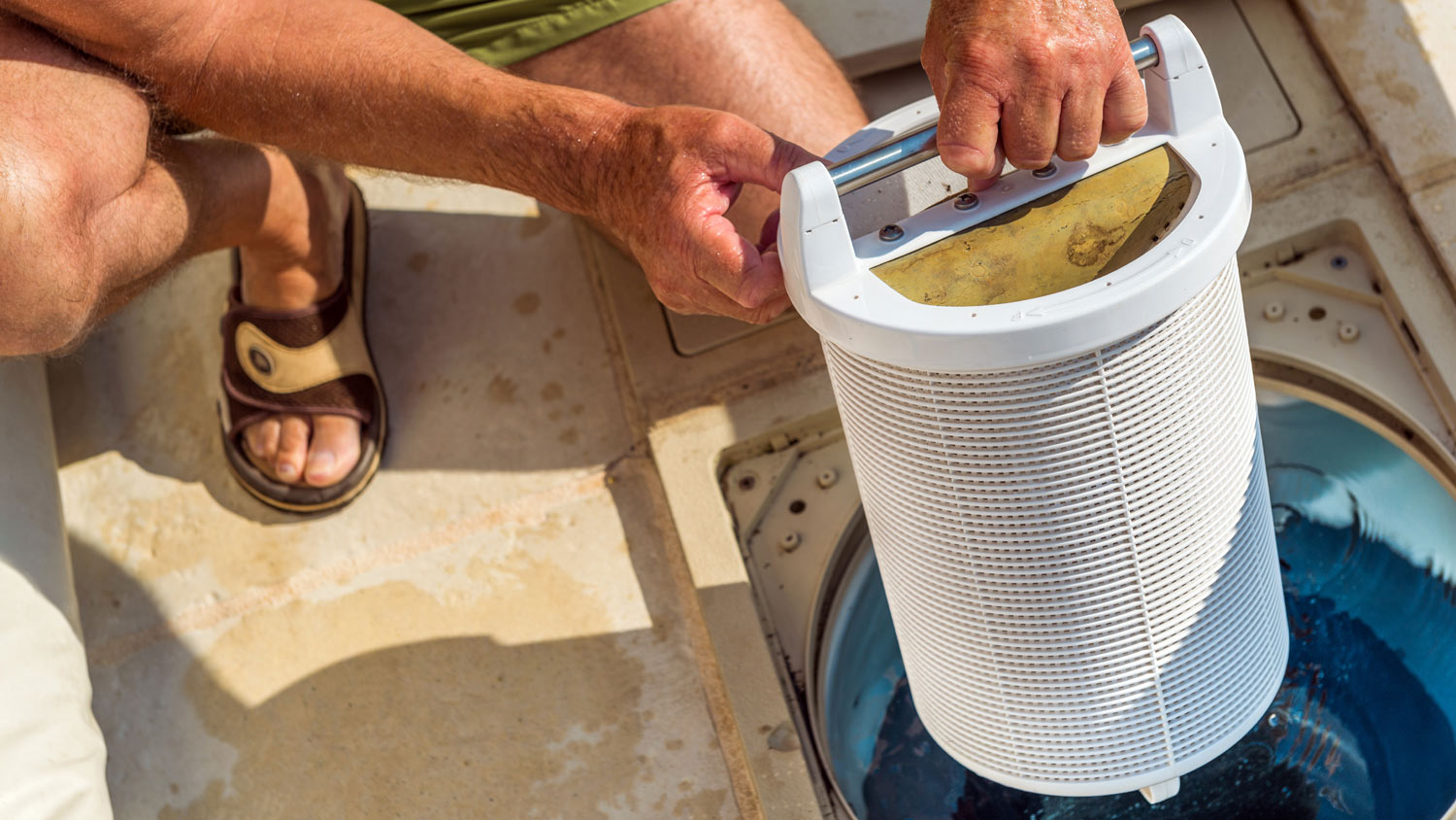 Man removing pool filtration system