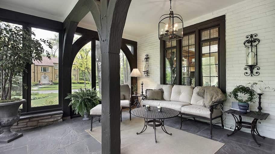 Screened-in porch with large wood beams