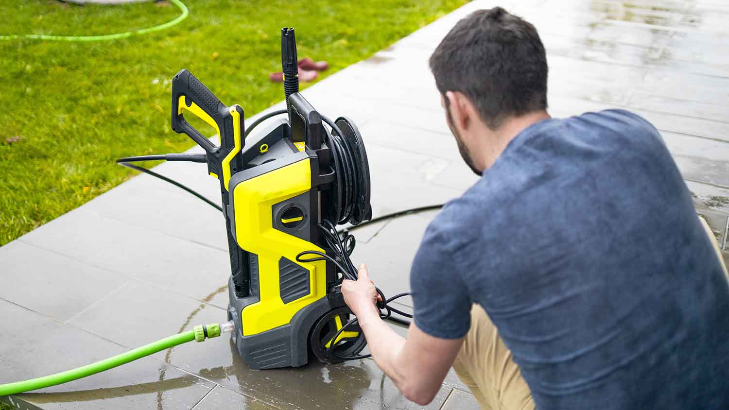 Man inspecting pressure washer