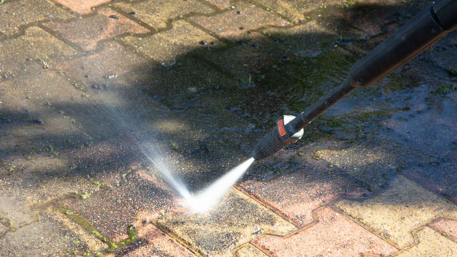 cleaning outside with pressure washer jet