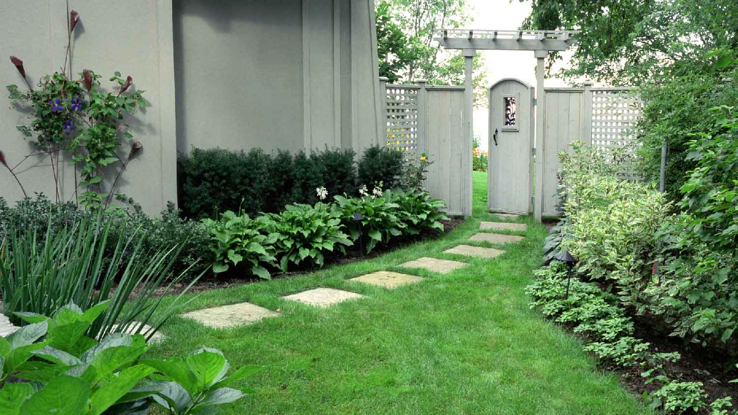 A private garden with a stone walkway