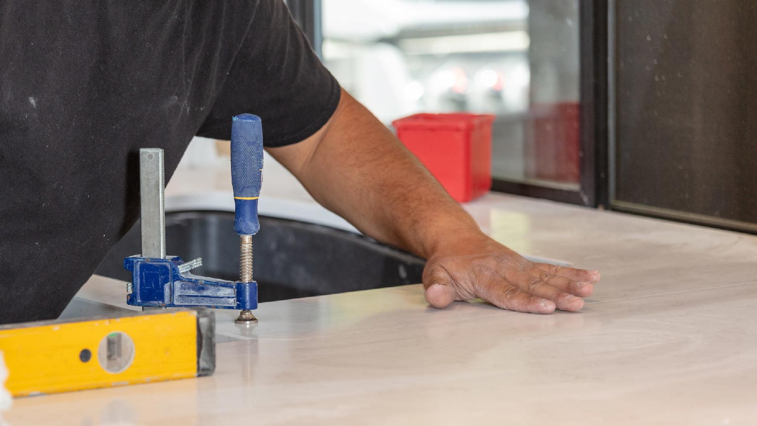 A professional checking a Dekton’s countertop seam 