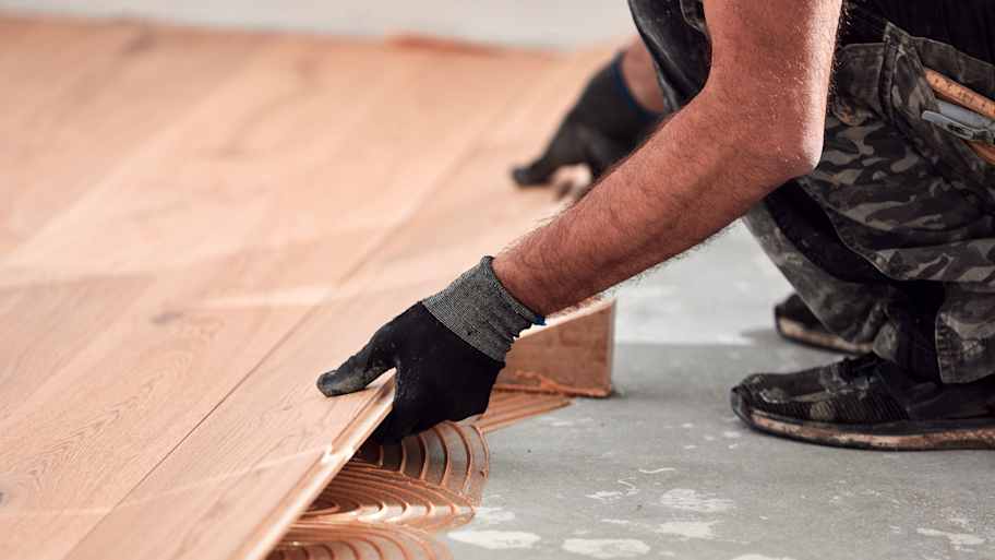 Professional installing engineered hardwood flooring 