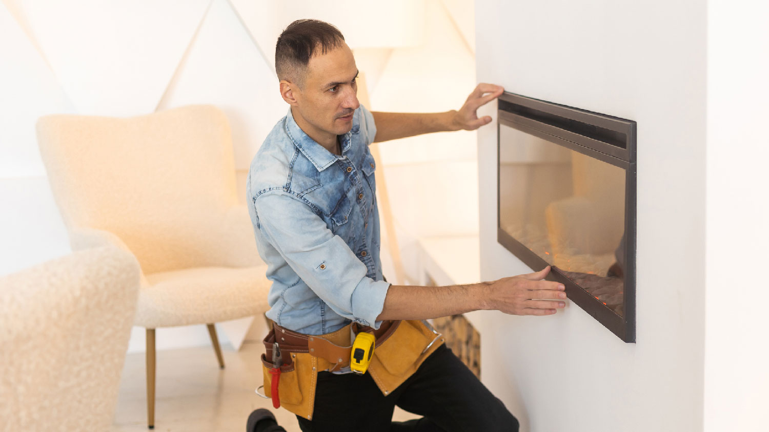 A professional inspecting an electric fireplace