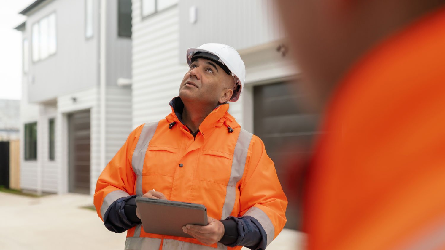 A professional inspecting a house for appraisal