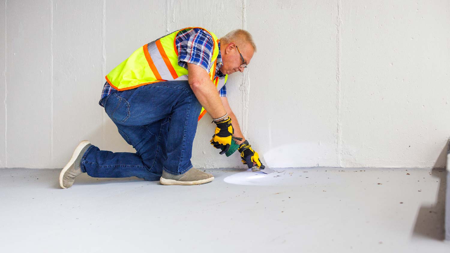 A professional inspecting for mold in the basement