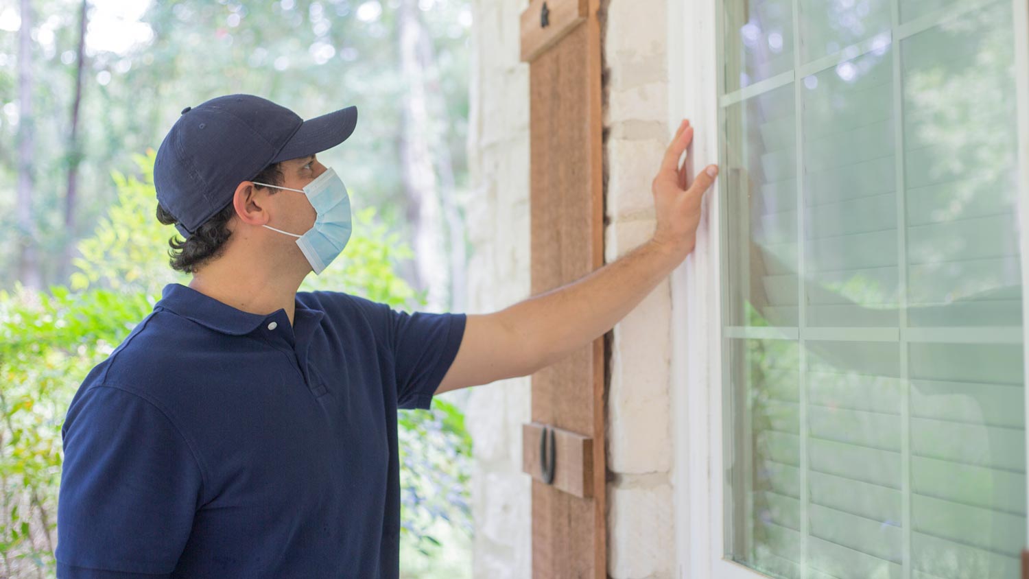professional inspector examing walls of home