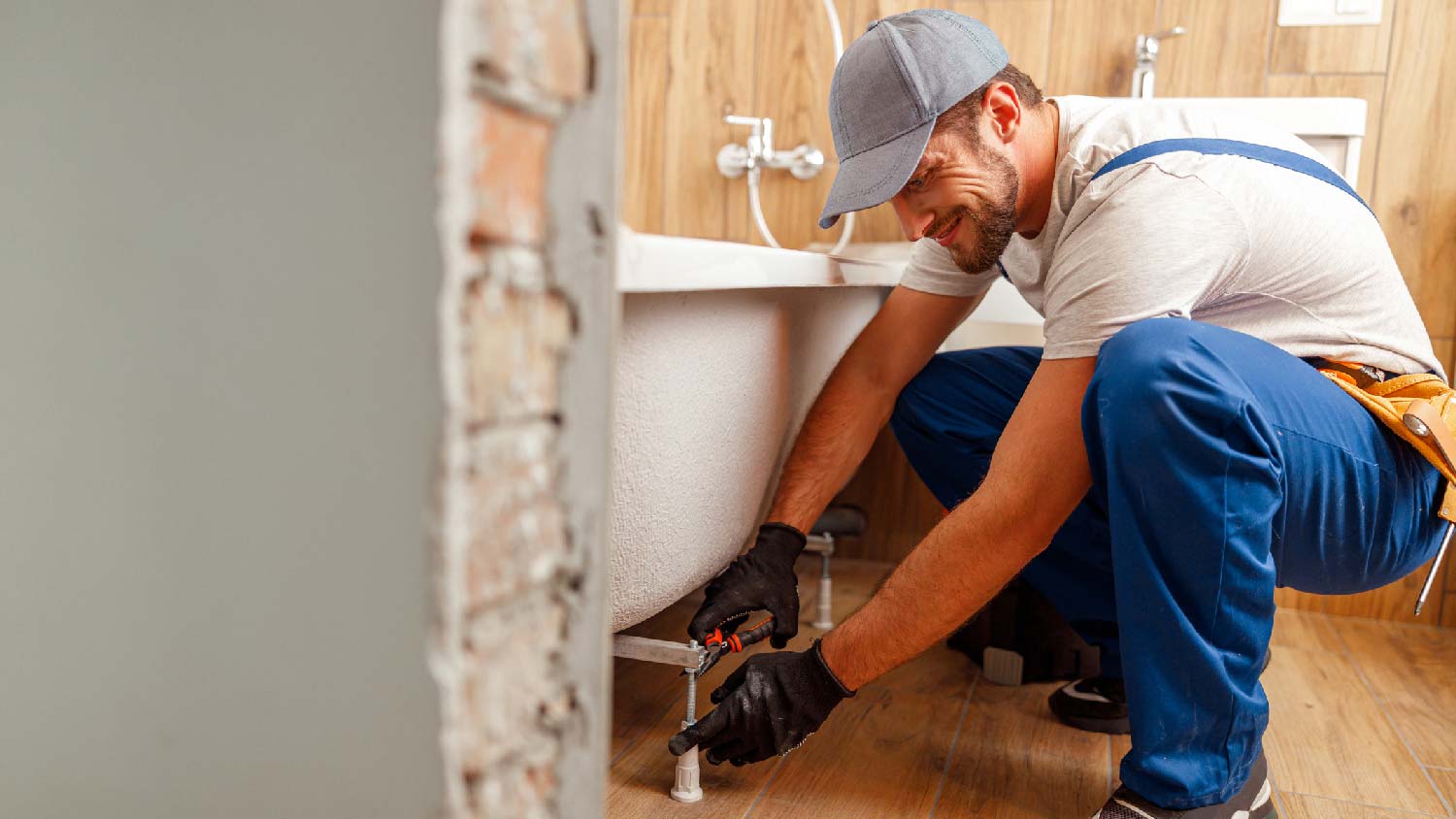 A professional installing a bathtub