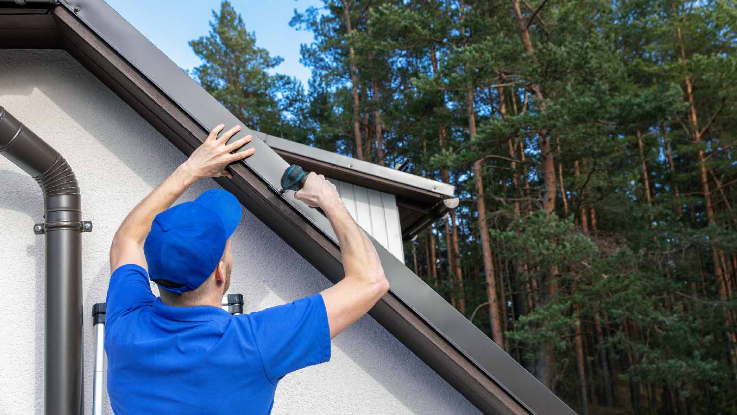 A professional installing a drip edge on a roof