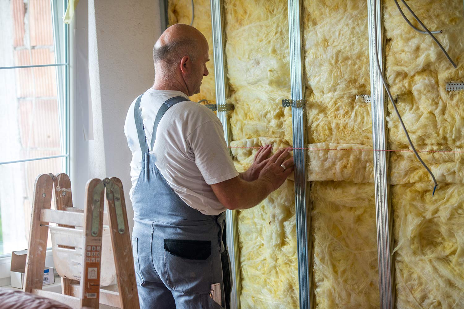 Professional working on insulation wall