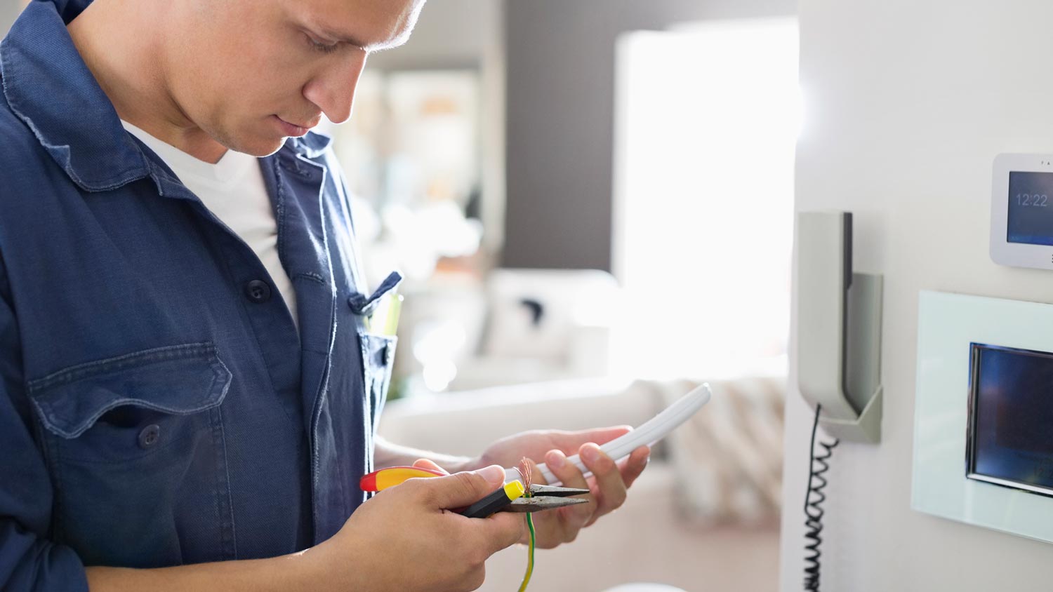 A professional installing a landline monitoring