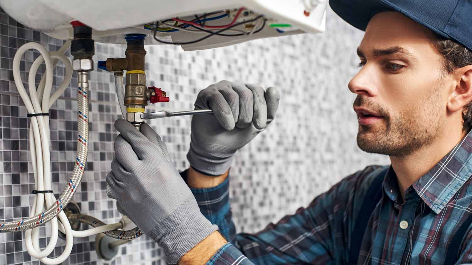 A professional installing a new water heater