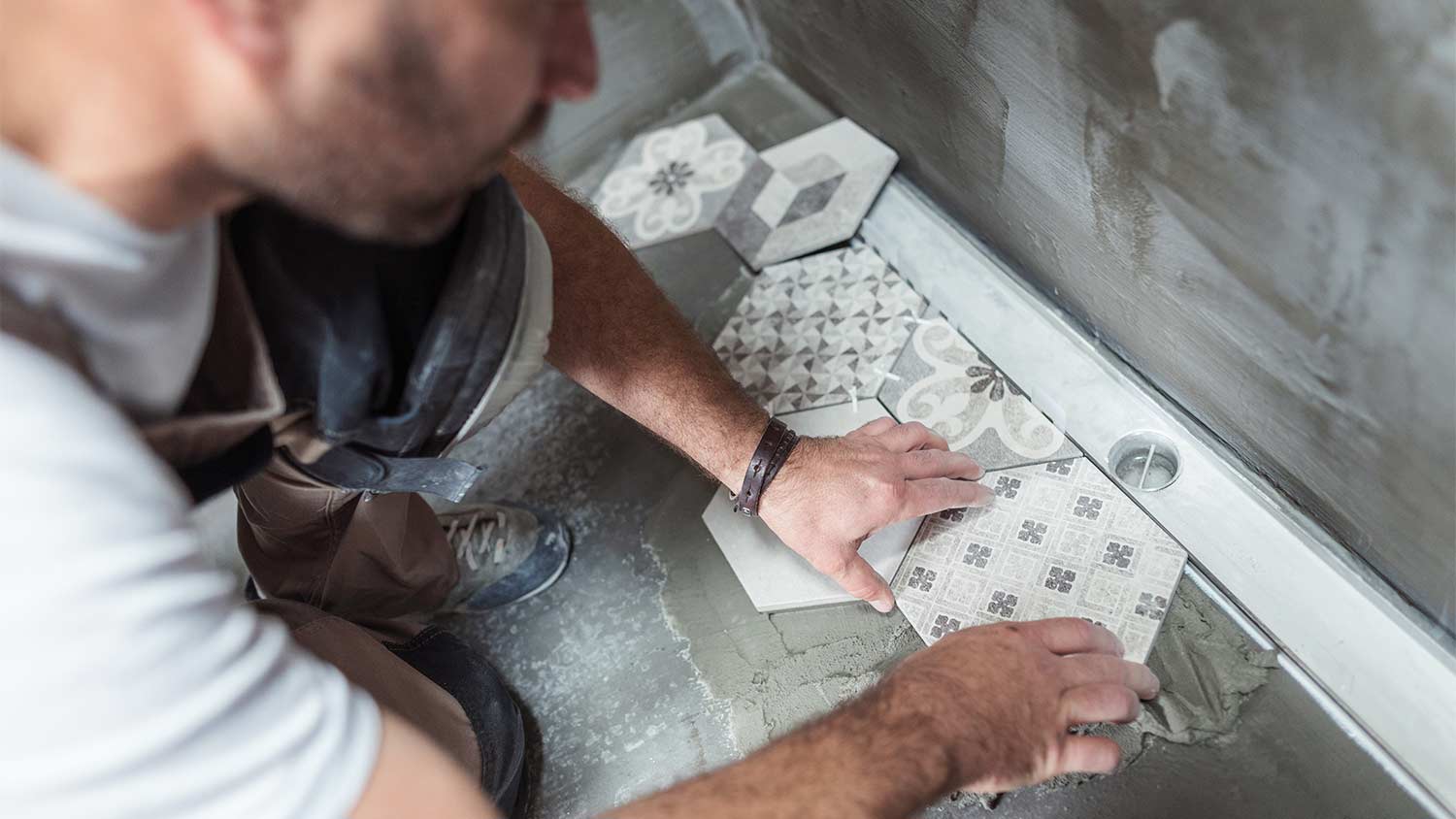 professional installing bathroom tiles