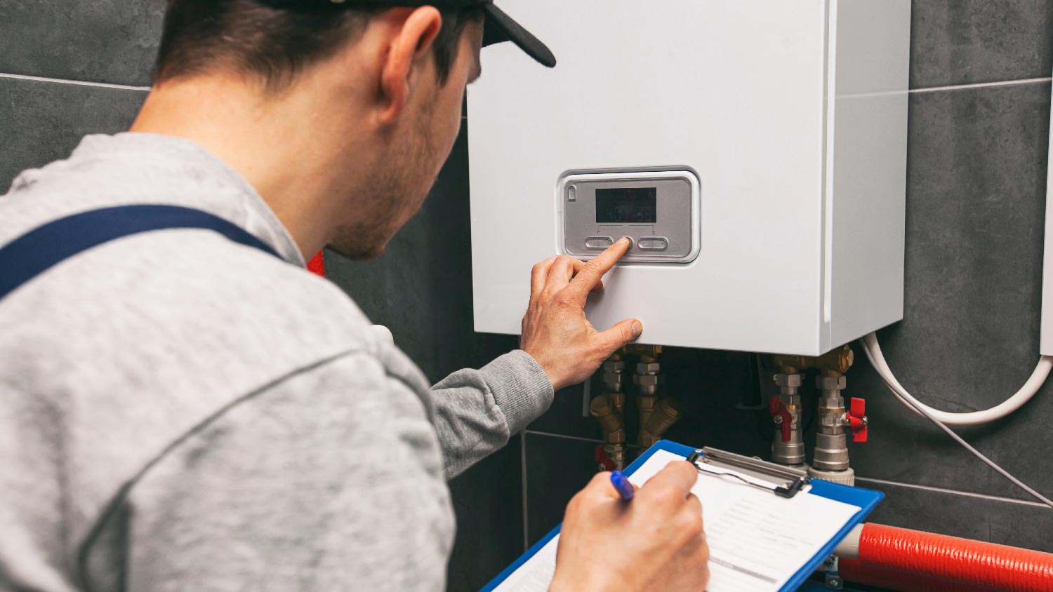 A professional installing a water heater