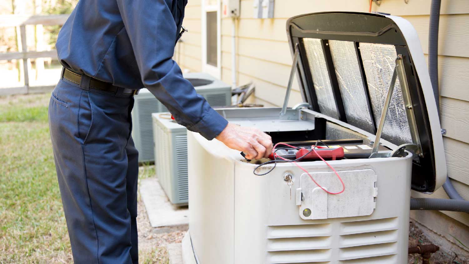 A professional maintaining a natural gas generator