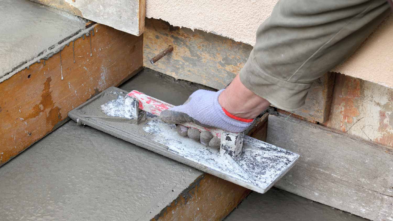 A professional repairing concrete steps